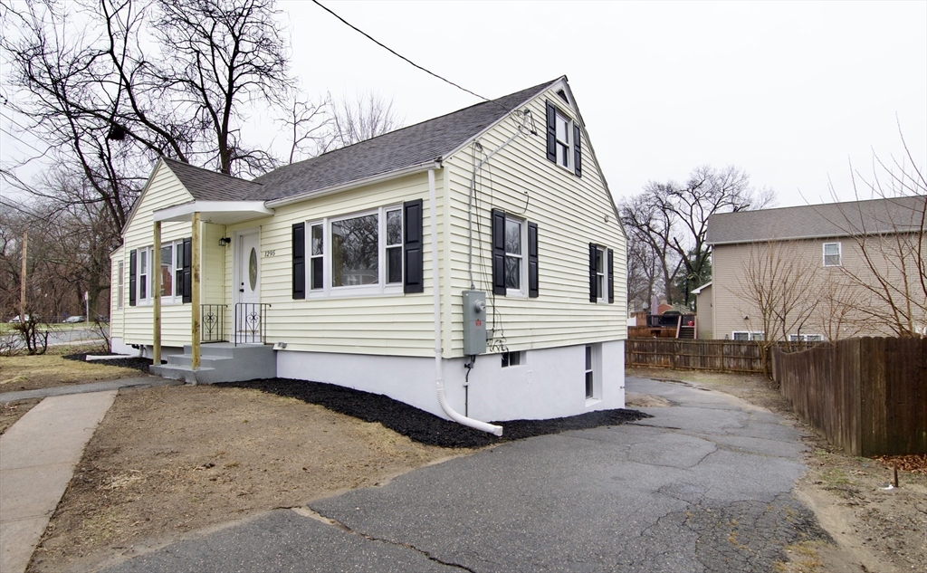 1295 Bay Street Springfield, MA 01109 - Photo 3 of 42 a view of a white house with a large space in front of it