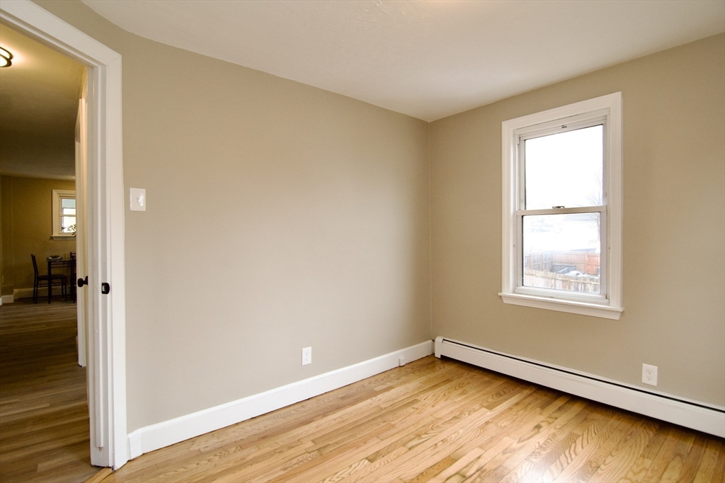 1295 Bay Street Springfield, MA 01109 - Photo 32 of 42 a view of a room with wooden floor and a window