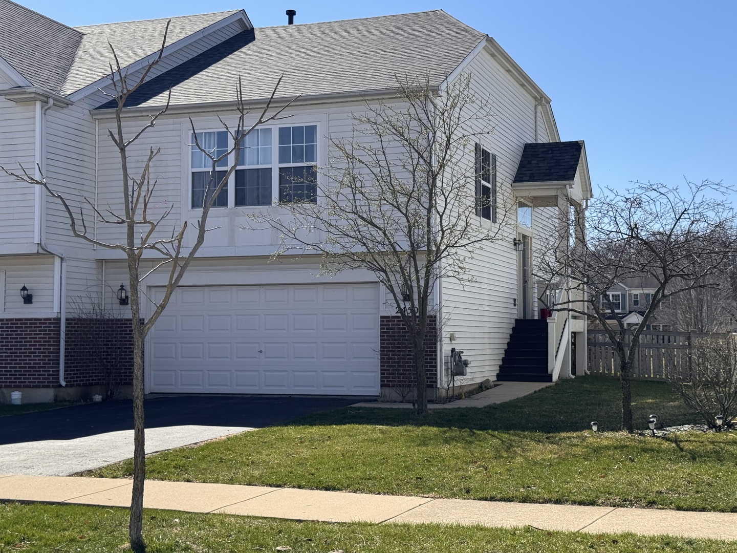 2450 Saddle Ridge Drive Joliet, IL 60432 - Photo 1 of 31 a front view of a house with garden