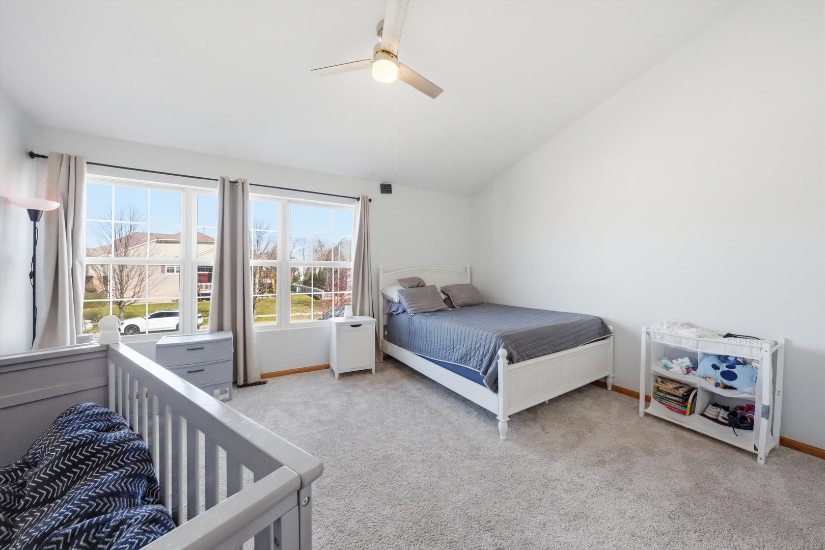 2450 Saddle Ridge Drive Joliet, IL 60432 - Photo 14 of 31 a spacious bedroom with a bed and a large window with the outer view