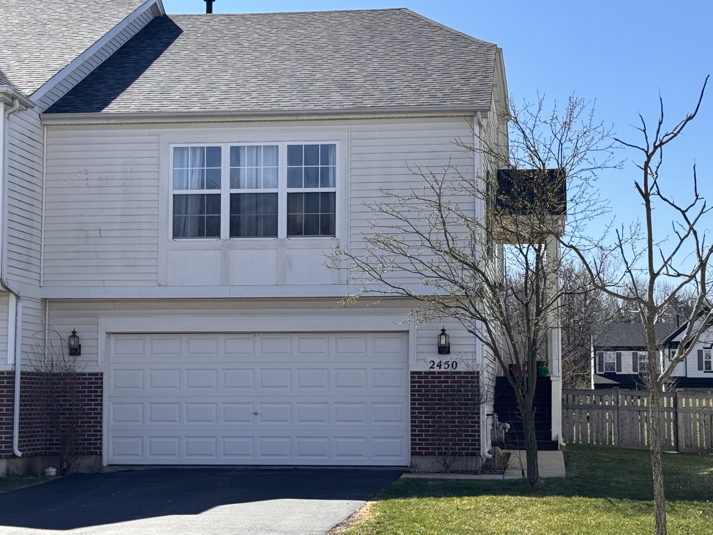 2450 Saddle Ridge Drive Joliet, IL 60432 - Photo 2 of 31 a front view of a house with a yard