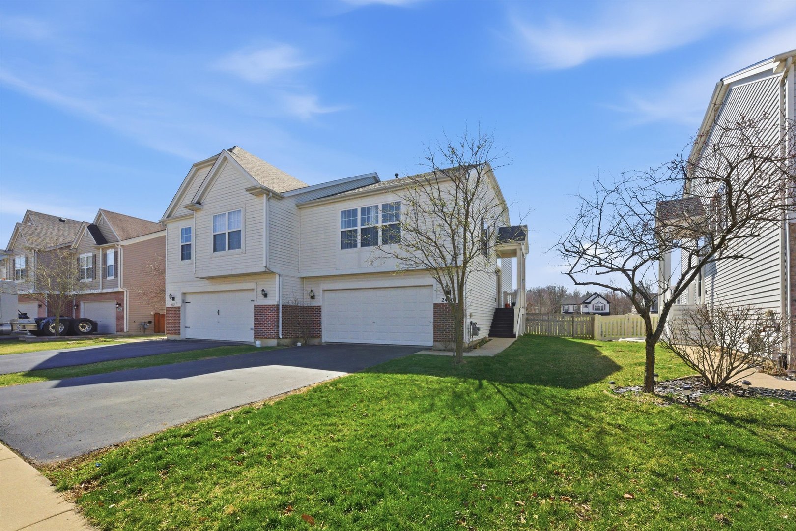2450 Saddle Ridge Drive Joliet, IL 60432 - Photo 3 of 31 a view of a house with a big yard and large trees