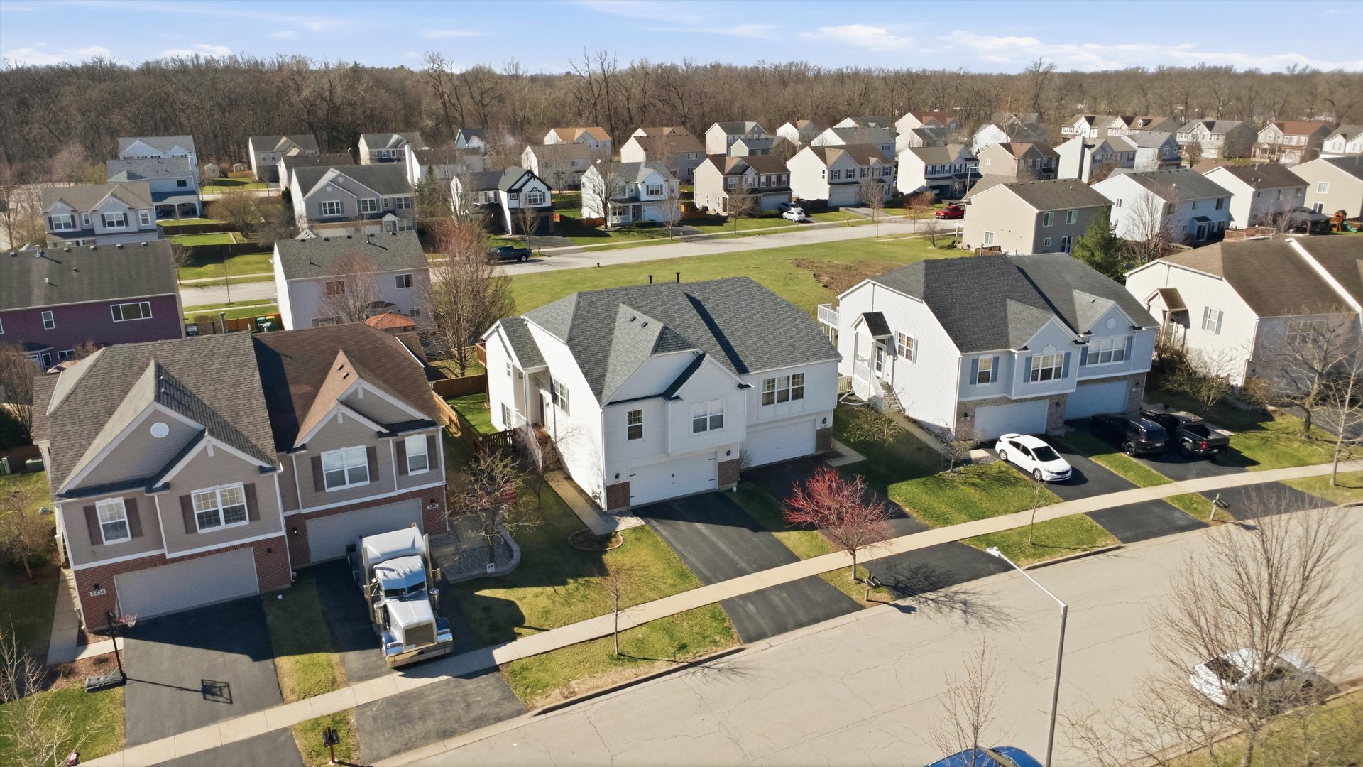 2450 Saddle Ridge Drive Joliet, IL 60432 - Photo 6 of 31 an aerial view of a house with a garden and lake view
