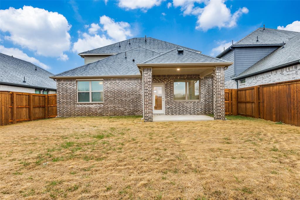 2544 Rambling Road Celina, TX 75009 - Photo 25 of 25 Back of property featuring a patio area and a yard