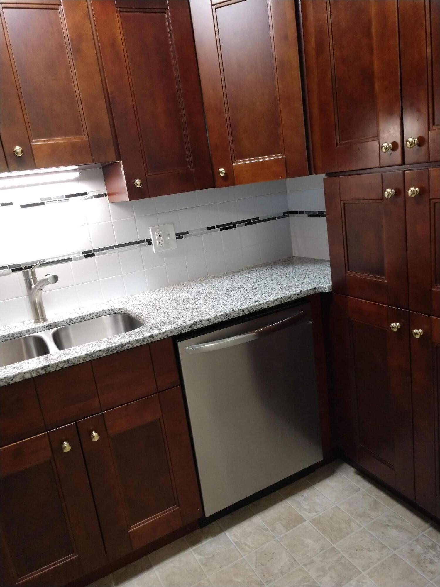 208 West Weber Road Columbus, OH 43202 - Photo 3 of 8 Newer cabinets, granite countertops, ceramic tile backsplash & dishwasher.
