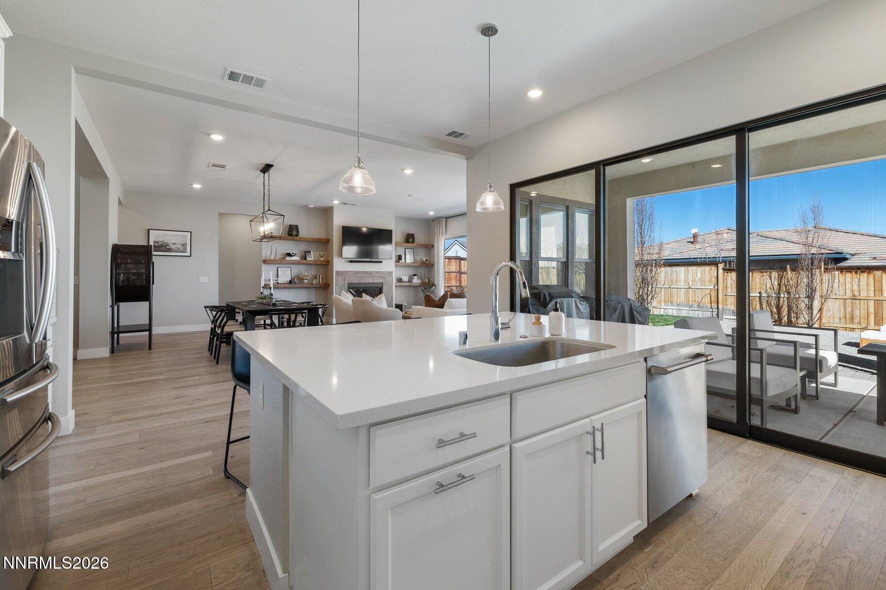 911 Solarium Drive Reno, NV 89511 - Photo 13 of 37 a kitchen with a sink stainless steel appliances and counter space