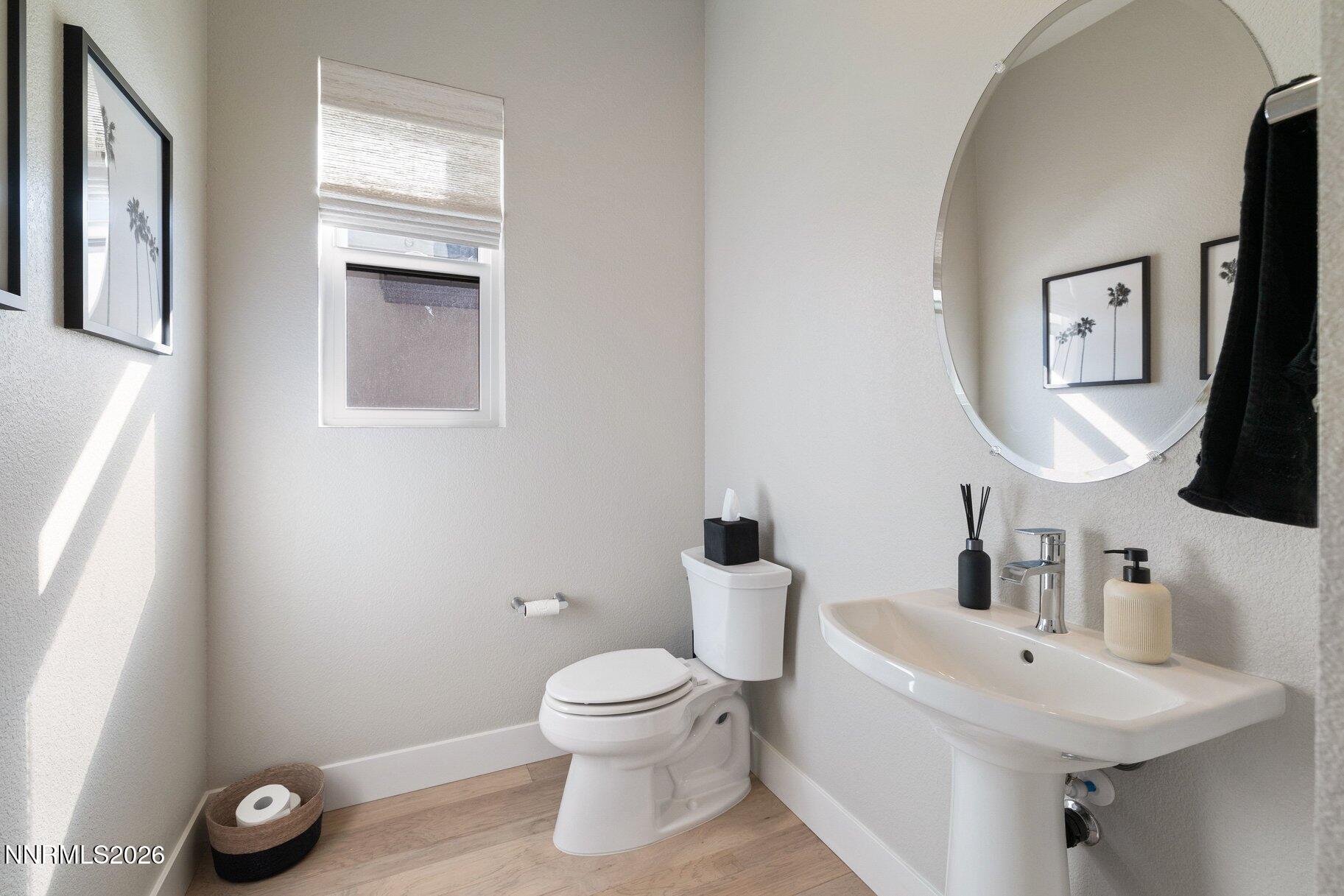 911 Solarium Drive Reno, NV 89511 - Photo 23 of 37 a bathroom with a toilet sink and mirror
