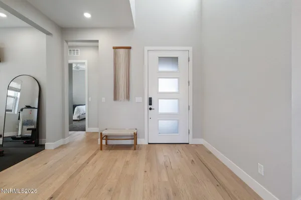 wooden floor with windows and closet