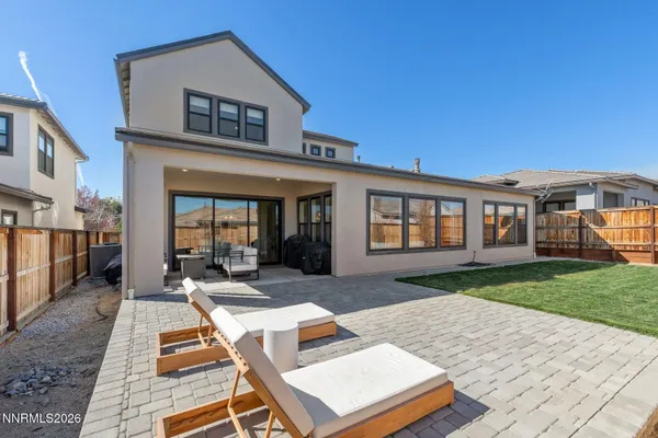 a backyard of a house with seating space