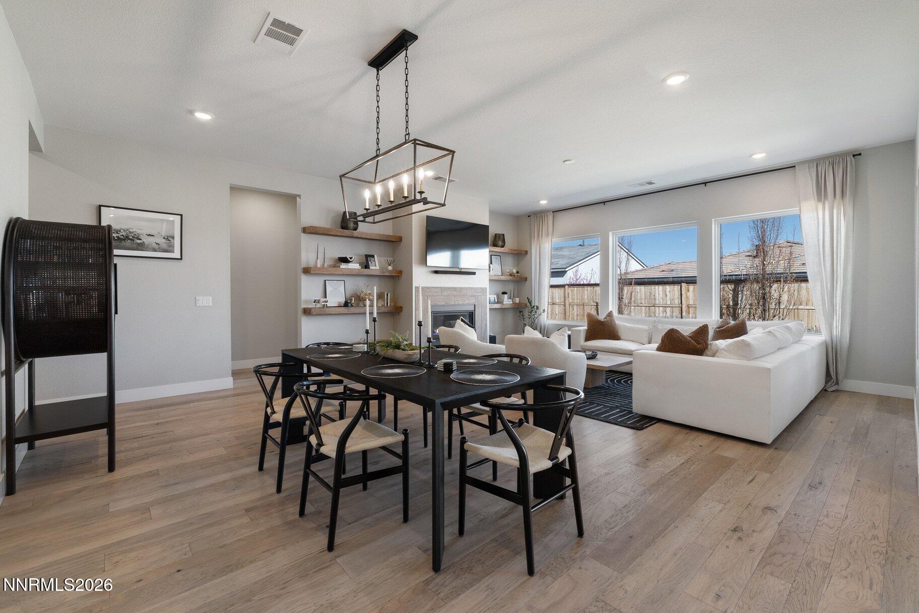 911 Solarium Drive Reno, NV 89511 - Photo 5 of 37 a view of a dining room with furniture window and wooden floor