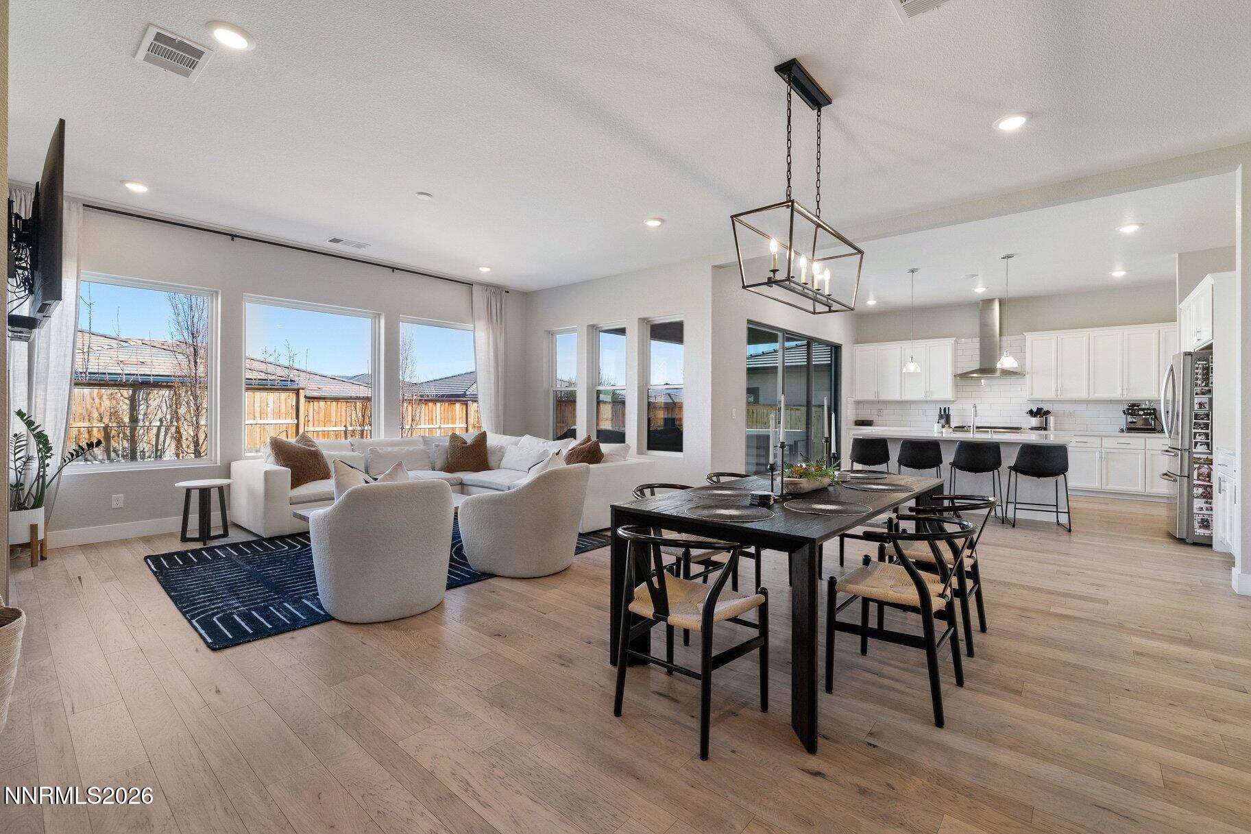 911 Solarium Drive Reno, NV 89511 - Photo 8 of 37 a view of a dining room with furniture window and wooden floor