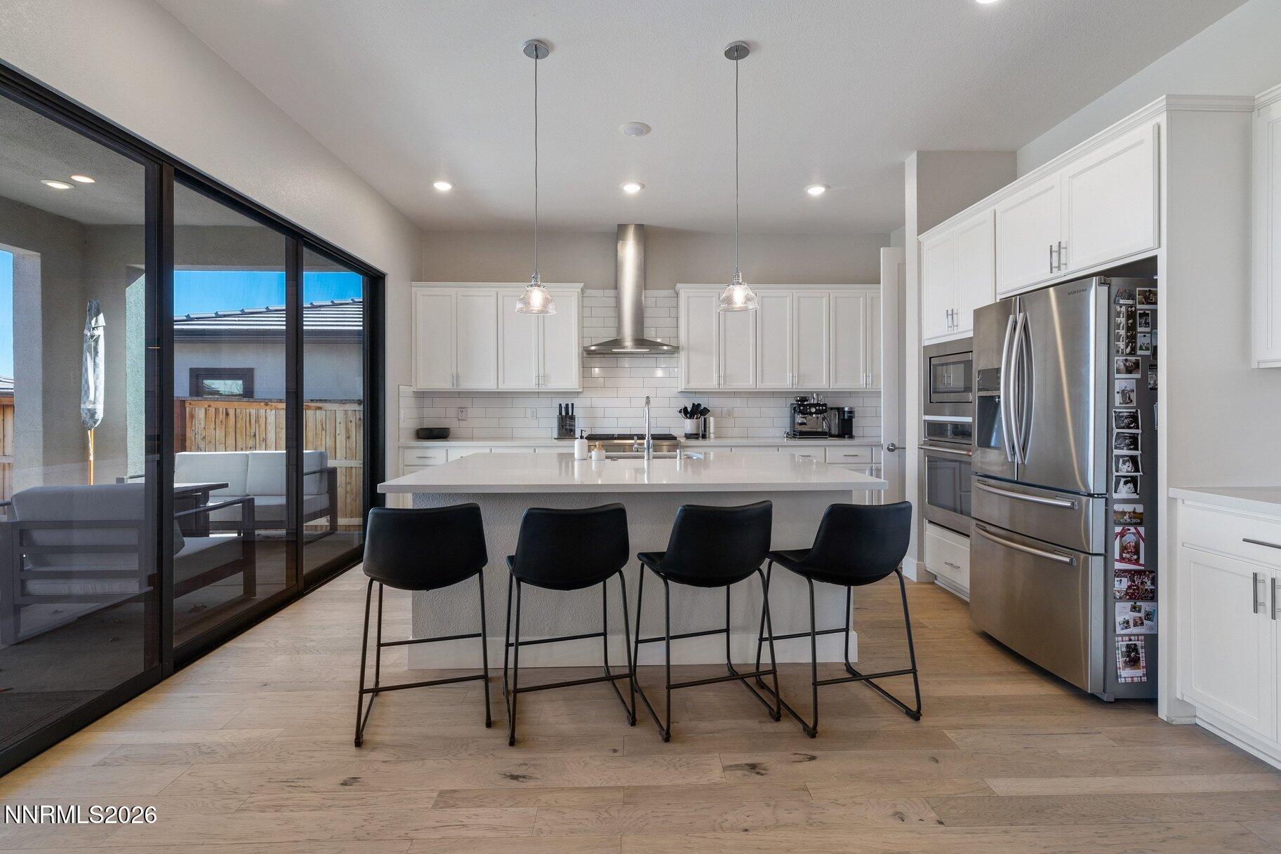 911 Solarium Drive Reno, NV 89511 - Photo 10 of 37 a kitchen with stainless steel appliances granite countertop a refrigerator a sink and a stove