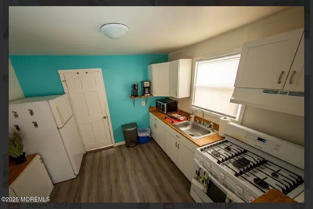 a room with furniture and a wooden floor