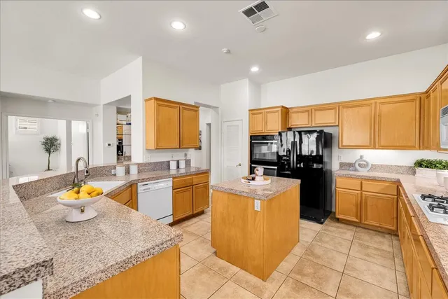 a utility room with a sink dryer and washer