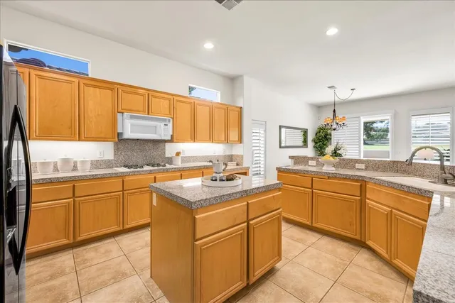 a picture of a bathroom with a sink and a mirror