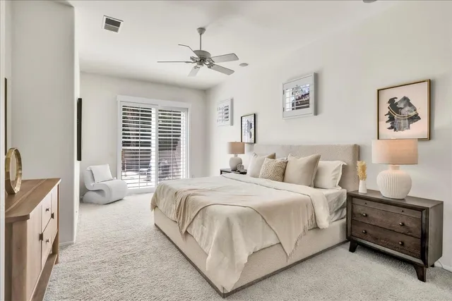 a view of a chairs and table in patio with a lake view
