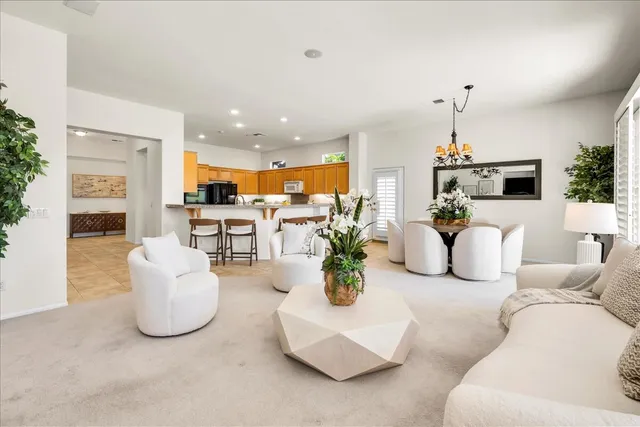 a bedroom with a bed and painting on the wall