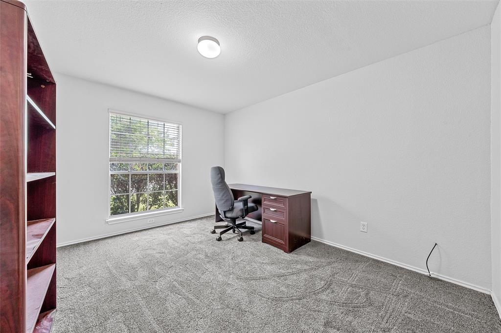 10120 Salem Way Waco, TX 76708 - Photo 11 of 19 a view of a workspace with furniture and a window