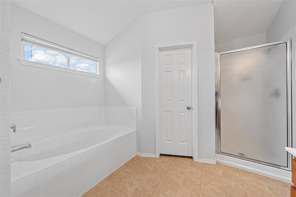 10120 Salem Way Waco, TX 76708 - Photo 15 of 19 a bathroom with a bathtub and a shower