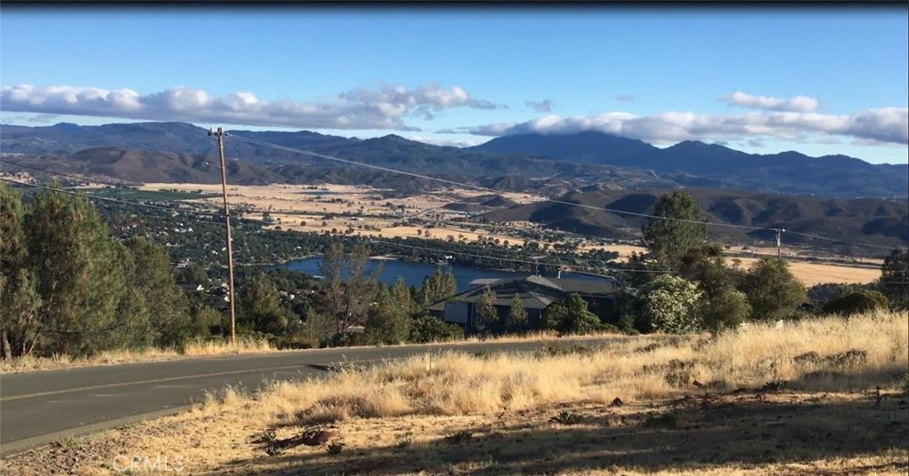 15965 Eagle Rock Road Hidden Valley Lake, CA 95467 - Photo 1 of 35 a view of a lake with a mountain in the background