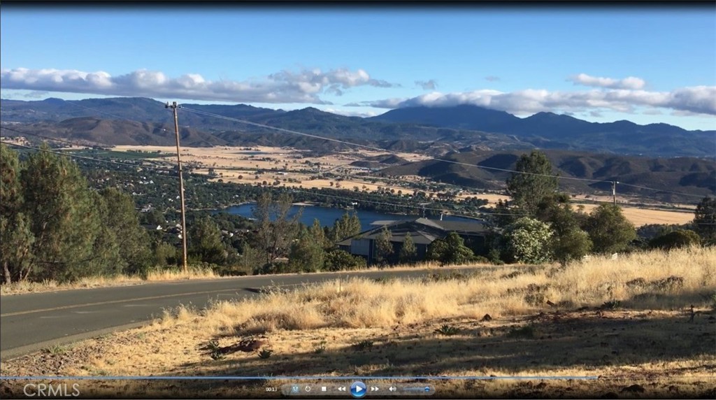 15965 Eagle Rock Road Hidden Valley Lake, CA 95467 - Photo 20 of 35 a view of a lake with a mountain