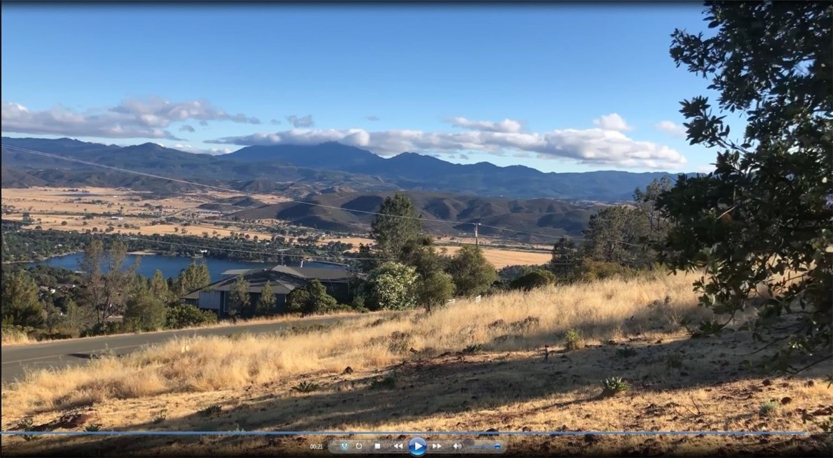 15965 Eagle Rock Road Hidden Valley Lake, CA 95467 - Photo 26 of 35 a view of a lake with a mountain