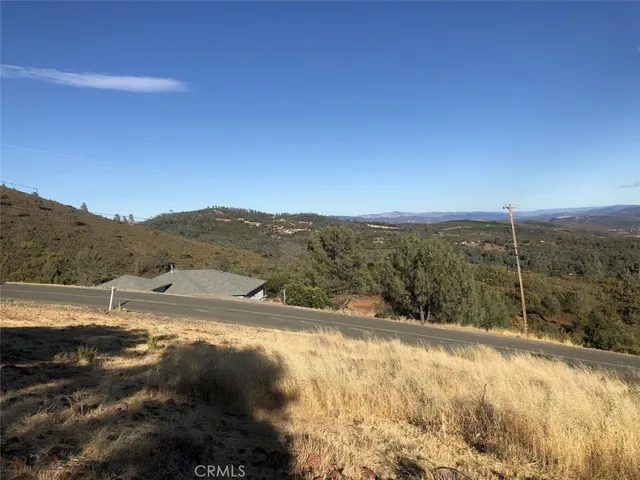 a view of a dry yard with mountain