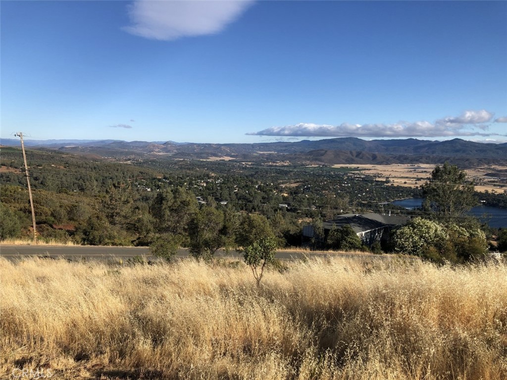 15965 Eagle Rock Road Hidden Valley Lake, CA 95467 - Photo 9 of 35 a view of a lake with mountains in the background