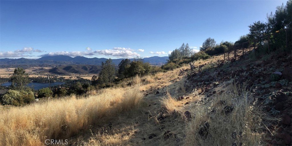15965 Eagle Rock Road Hidden Valley Lake, CA 95467 - Photo 10 of 35 a view of a lake with mountains in the background