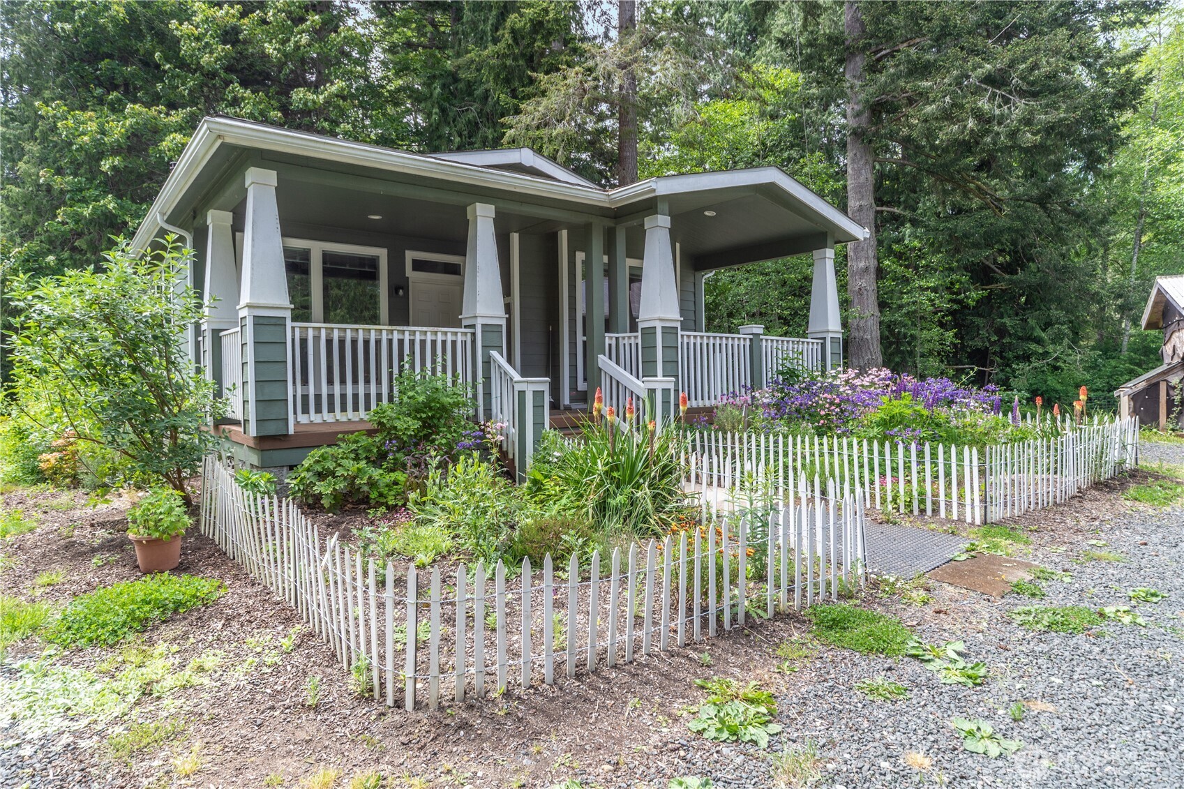 290 Werner Road Port Ludlow, WA 98365 - Photo 8 of 40 a view of a house with a small yard and plants