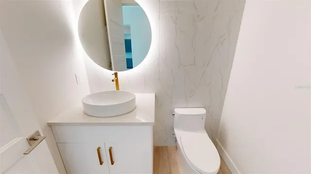 a bathroom with a toilet and a sink