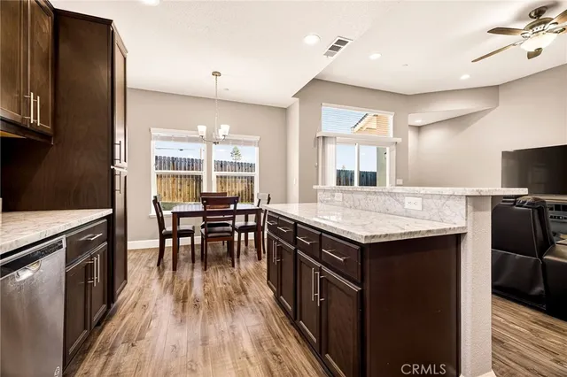 a kitchen with sink and refrigerator