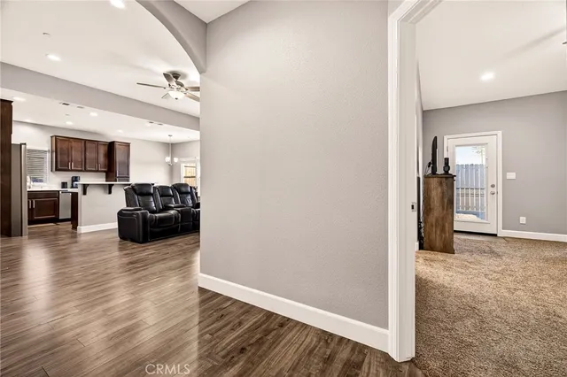 a bedroom with a bed and a ceiling fan