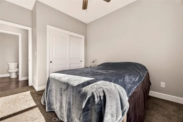 a bed room with a bed and a window