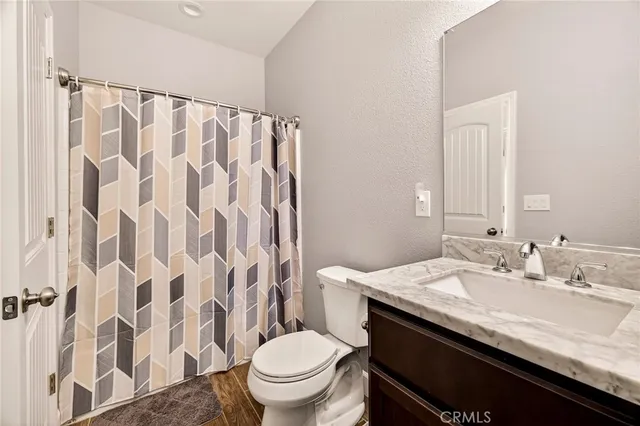 a en suite bathroom with a sink and a mirror