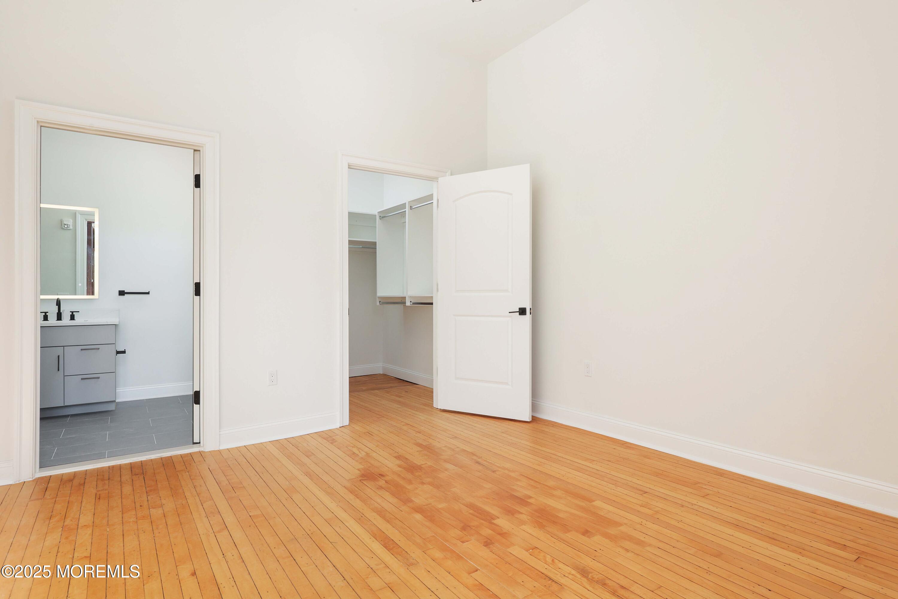 179 Chelsea Avenue, Unit 210 Long Branch, NJ 07740 - Photo 18 of 22 a view of empty room with wooden floor