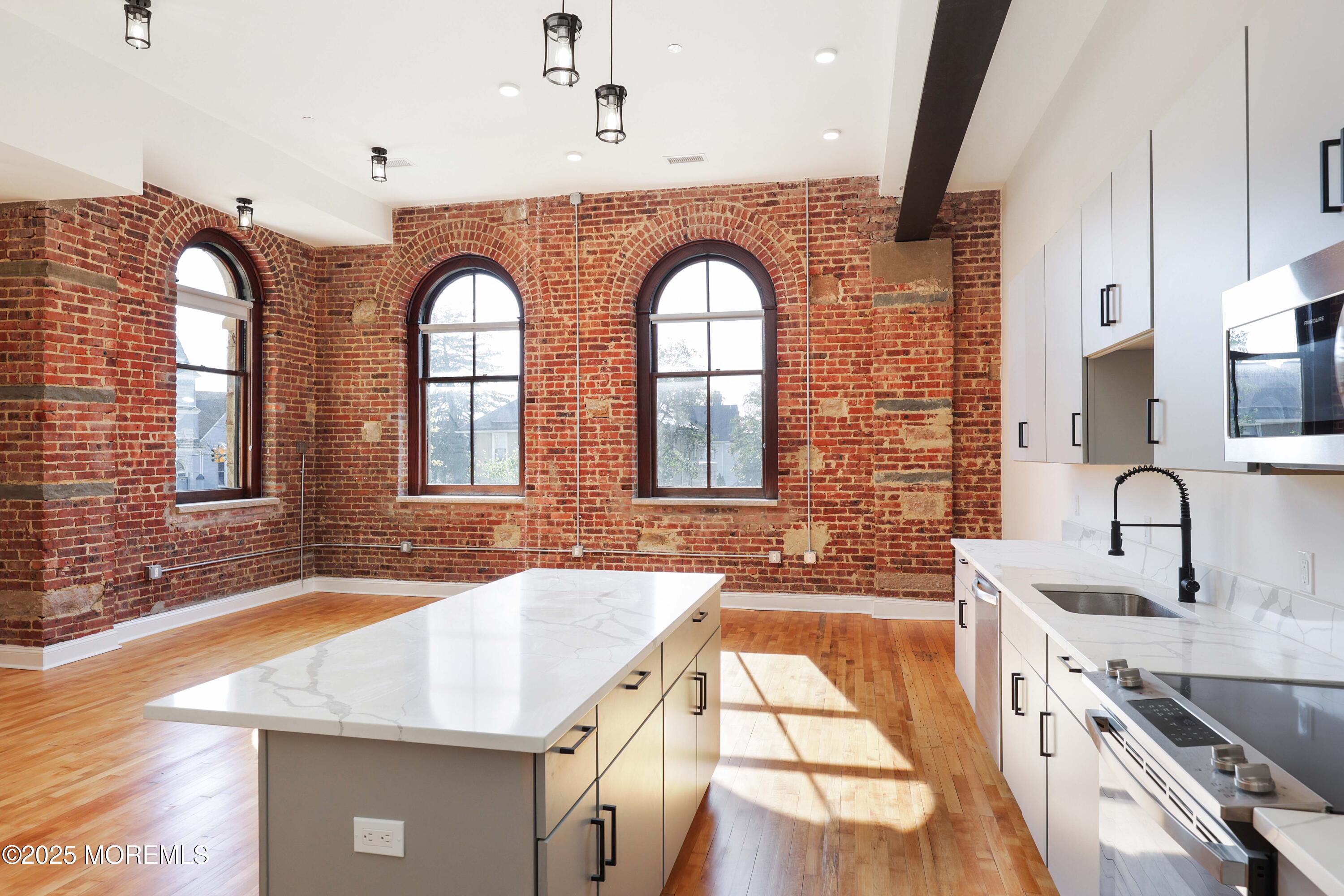 179 Chelsea Avenue, Unit 210 Long Branch, NJ 07740 - Photo 5 of 22 a bathroom with 2 sink and a bathtub