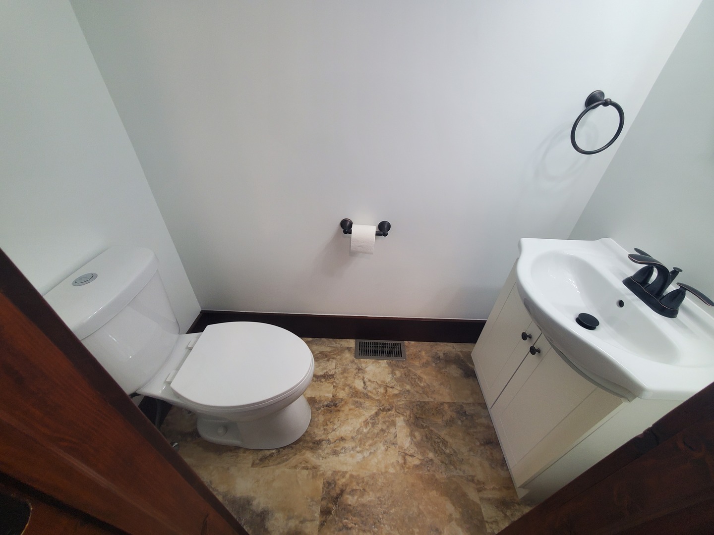 712 3rd Street Moline, IL 61265 - Photo 14 of 29 a bathroom with a toilet and a sink