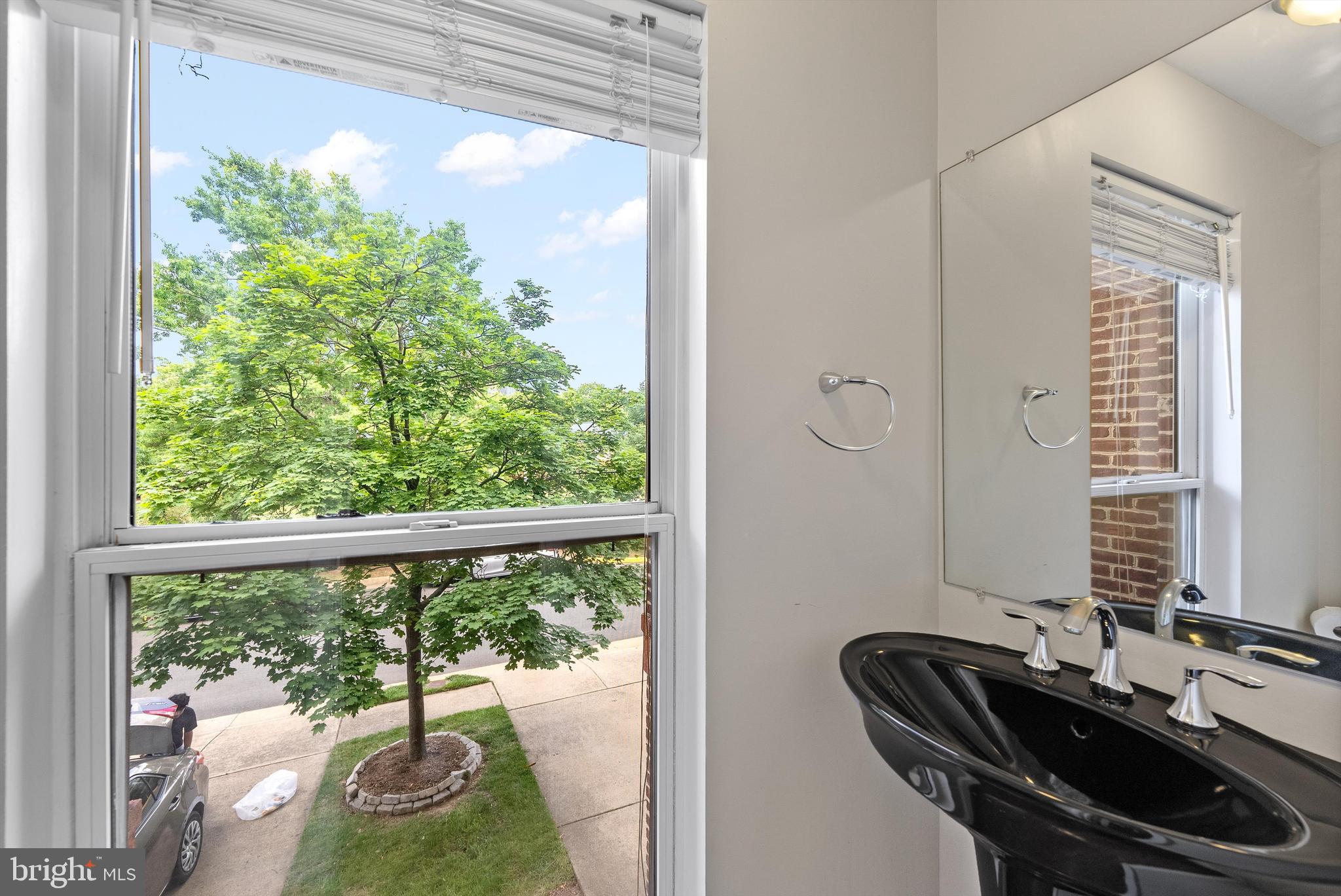 12081 Edgemere Circle Reston, VA 20190 - Photo 12 of 36 a view of a room that has a bed and a table in it