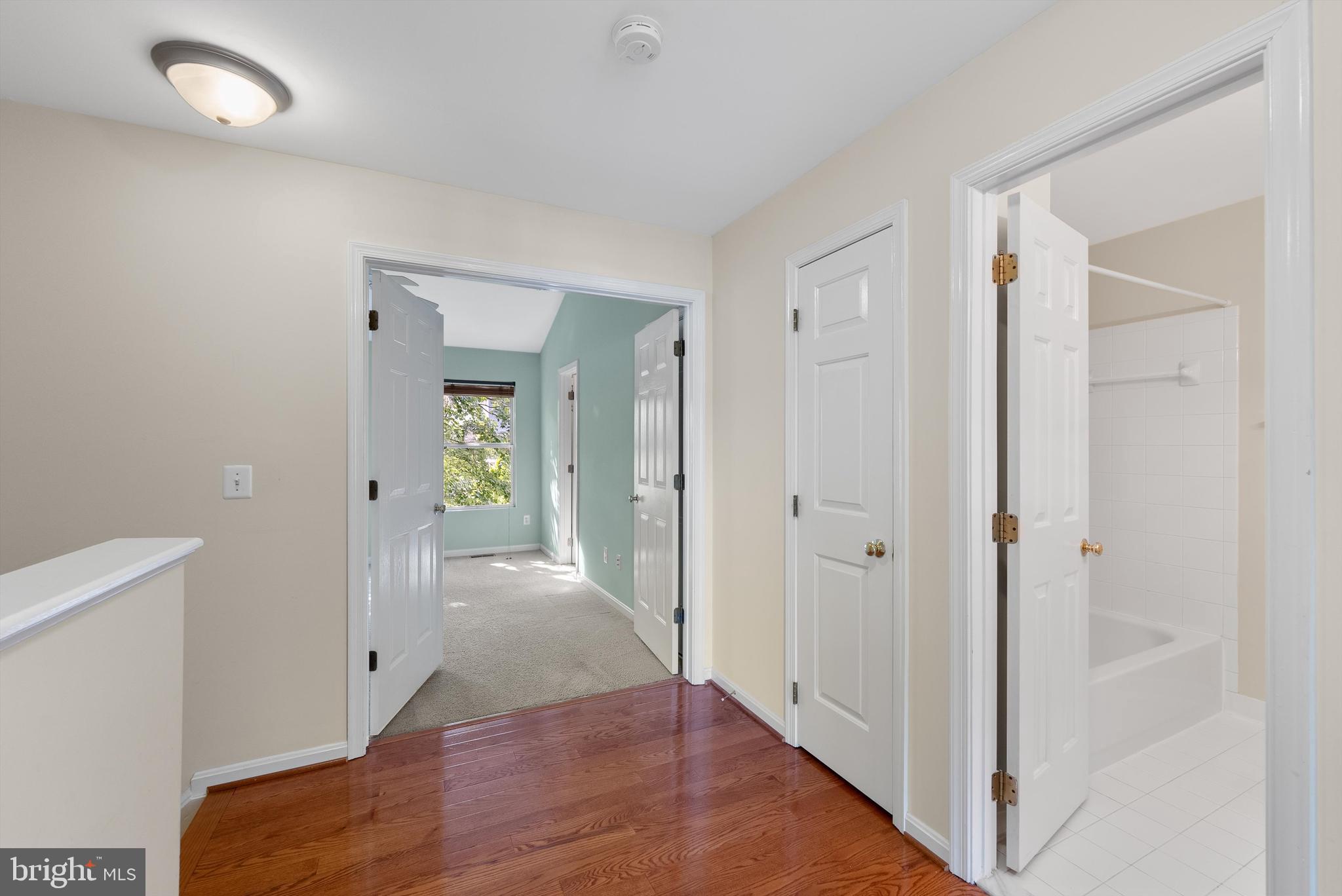 12081 Edgemere Circle Reston, VA 20190 - Photo 13 of 36 a view of a hallway with wooden floor