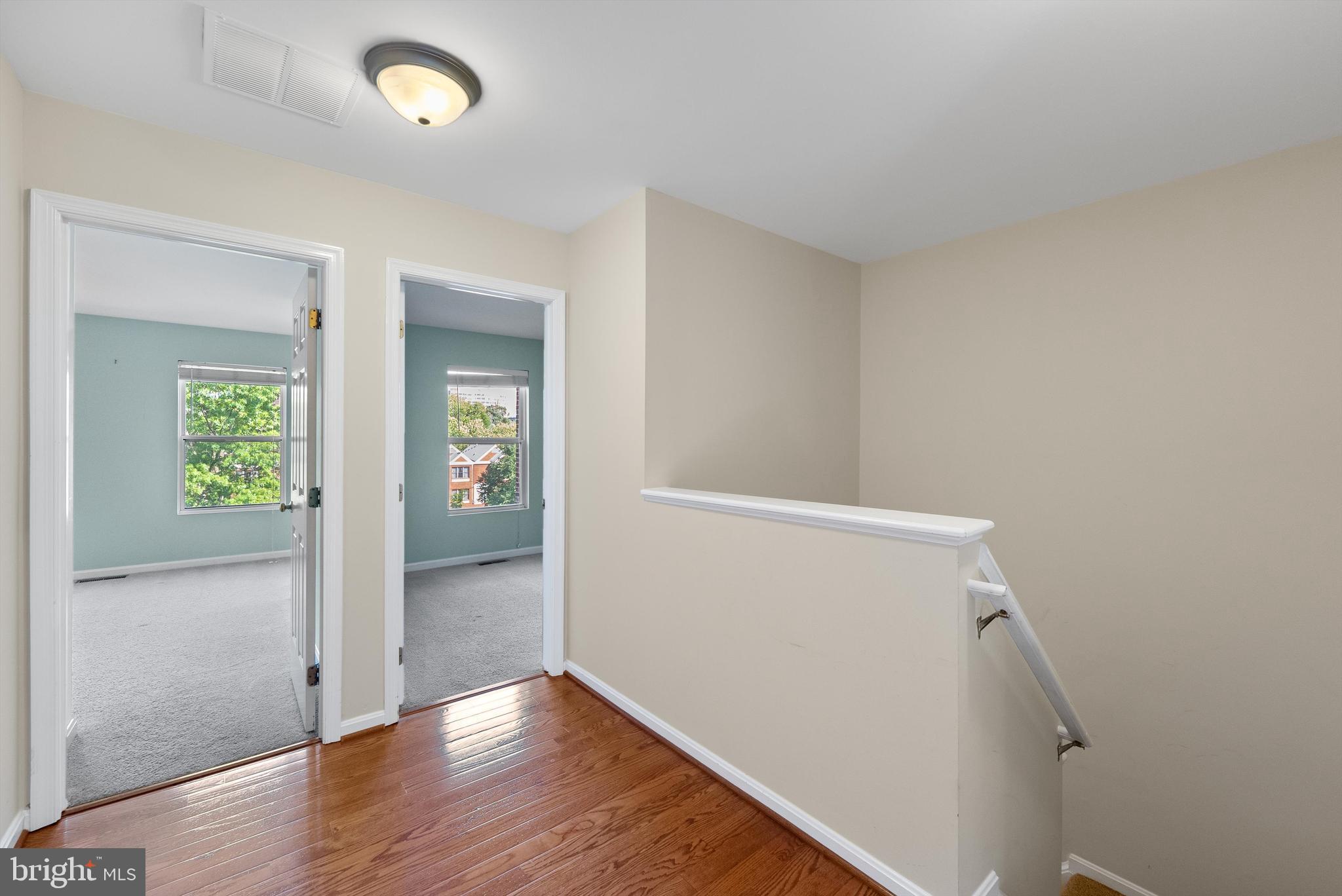 12081 Edgemere Circle Reston, VA 20190 - Photo 20 of 36 an empty room with wooden floor and windows