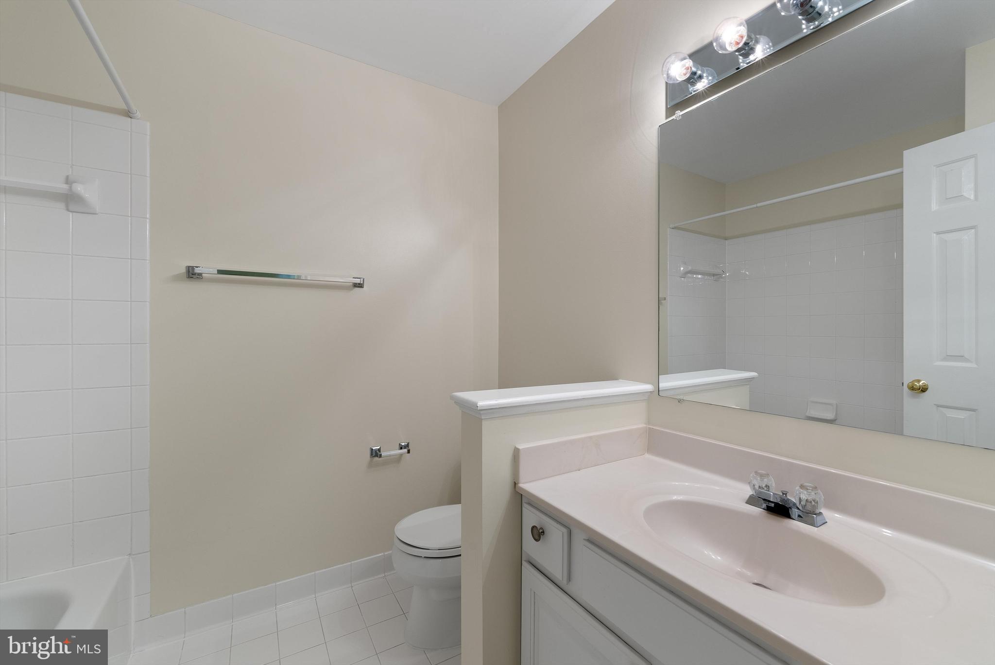 12081 Edgemere Circle Reston, VA 20190 - Photo 23 of 36 a bathroom with a sink toilet and vanity