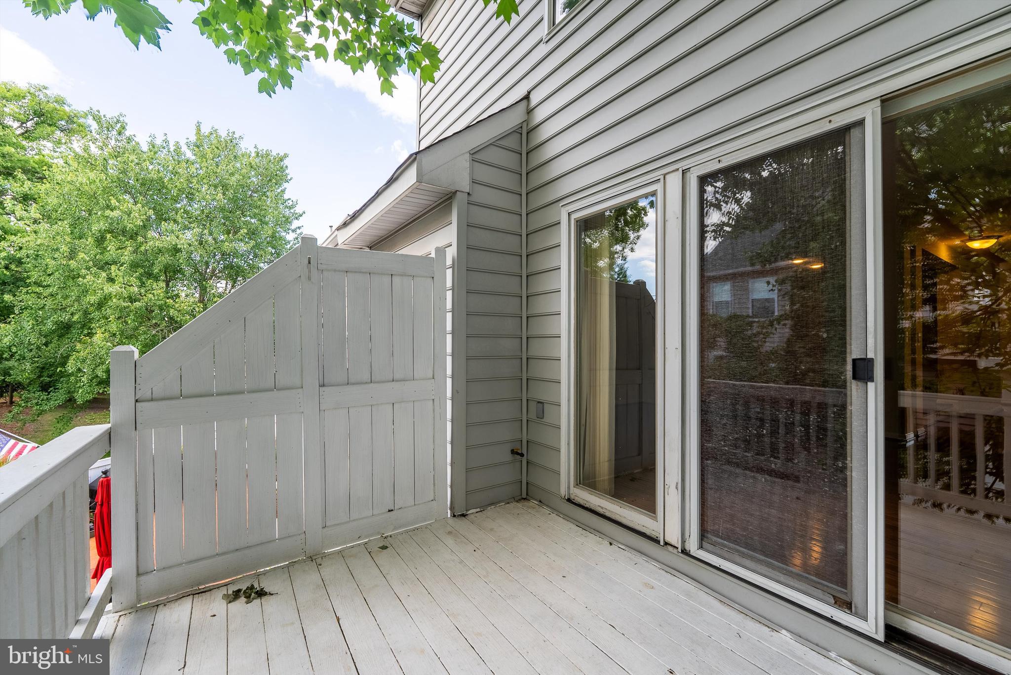 12081 Edgemere Circle Reston, VA 20190 - Photo 33 of 36 a view of small space in front of a house with wooden fence