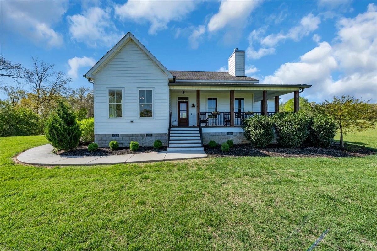 150 Edie Mae Lane Winchester, TN 37398 - Photo 1 of 79 a front view of a house with garden