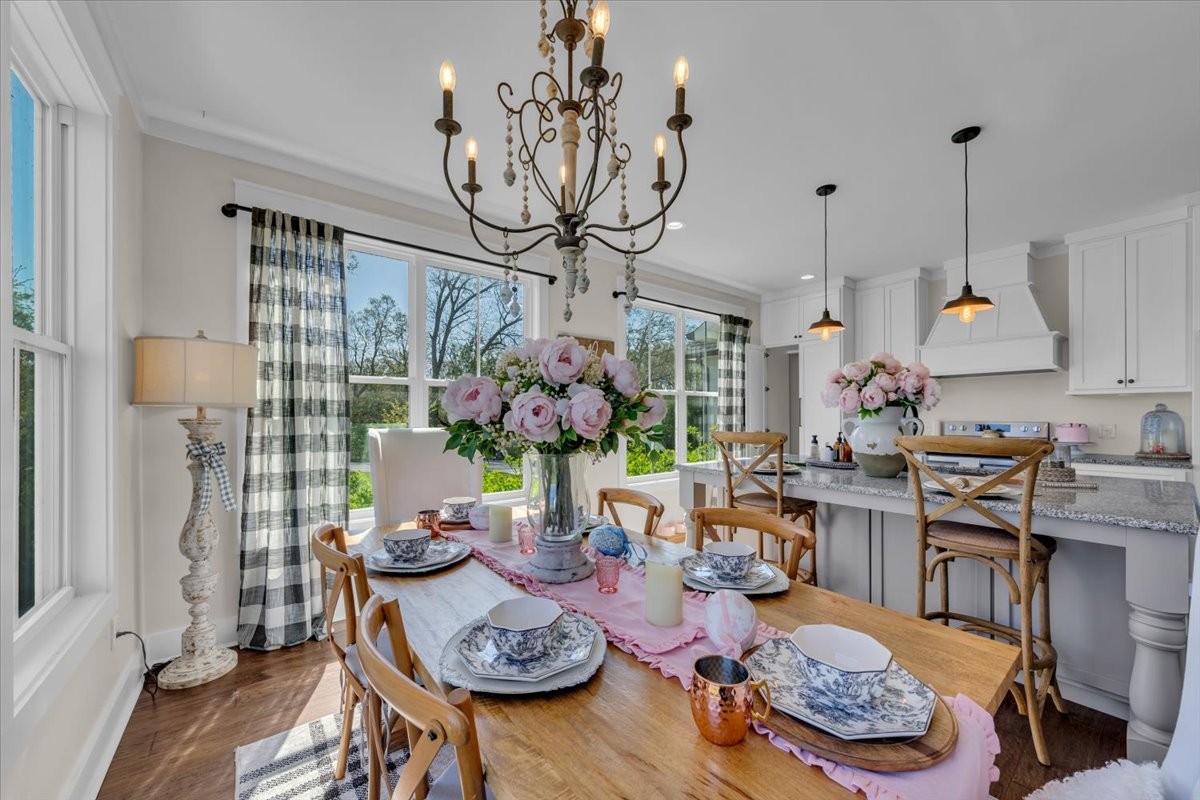 150 Edie Mae Lane Winchester, TN 37398 - Photo 18 of 79 a view of a dining room with furniture a chandelier and wooden floor