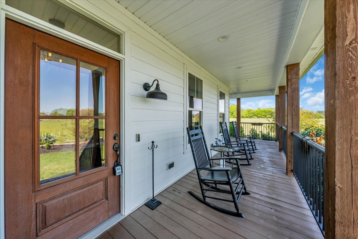 150 Edie Mae Lane Winchester, TN 37398 - Photo 3 of 79 a view of a balcony with chairs and wooden floor