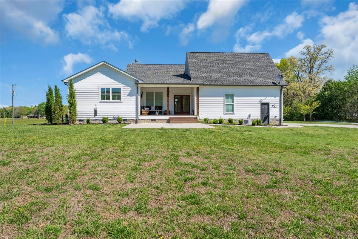 150 Edie Mae Lane Winchester, TN 37398 - Photo 52 of 79 a front view of a house with a yard and garage