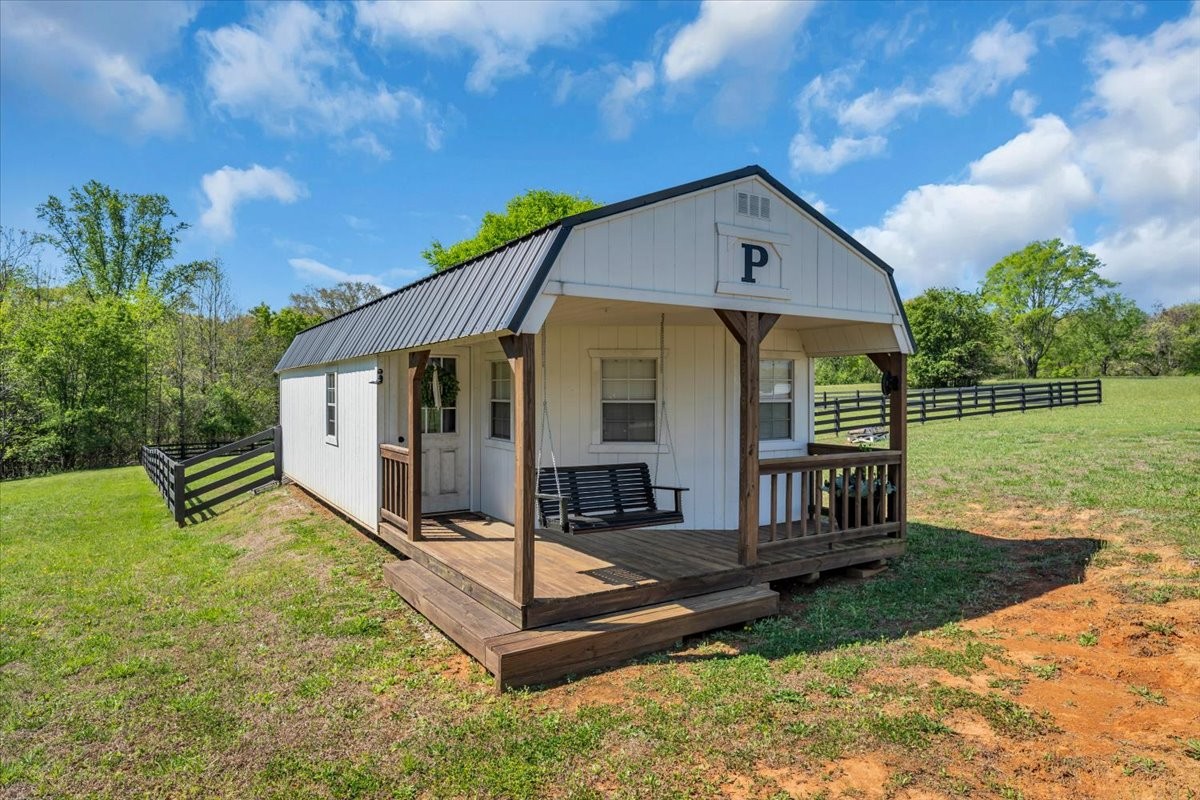 150 Edie Mae Lane Winchester, TN 37398 - Photo 64 of 79 a front view of a house with a yard table and chairs
