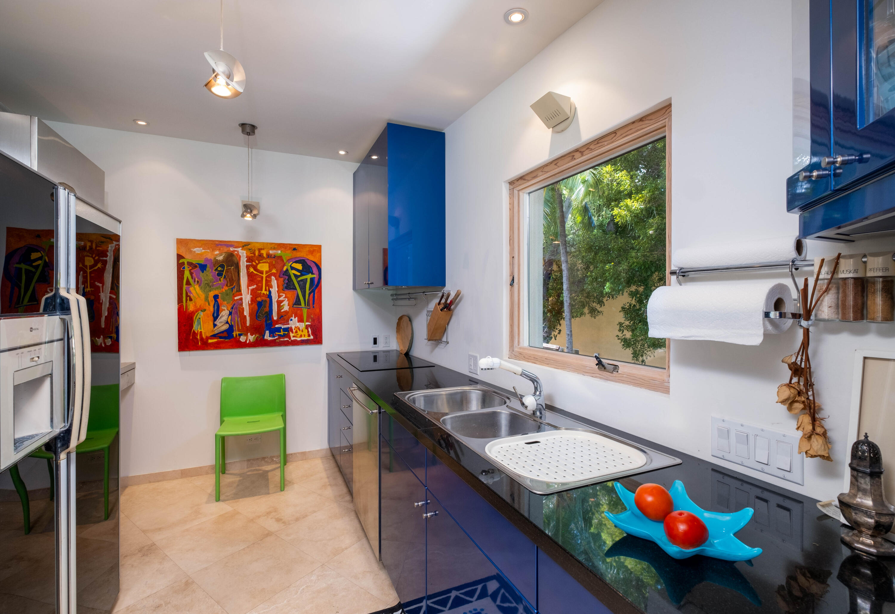 180 South Airport Road Tavernier, FL 33070 - Photo 12 of 33 a kitchen with a sink stove and cabinets