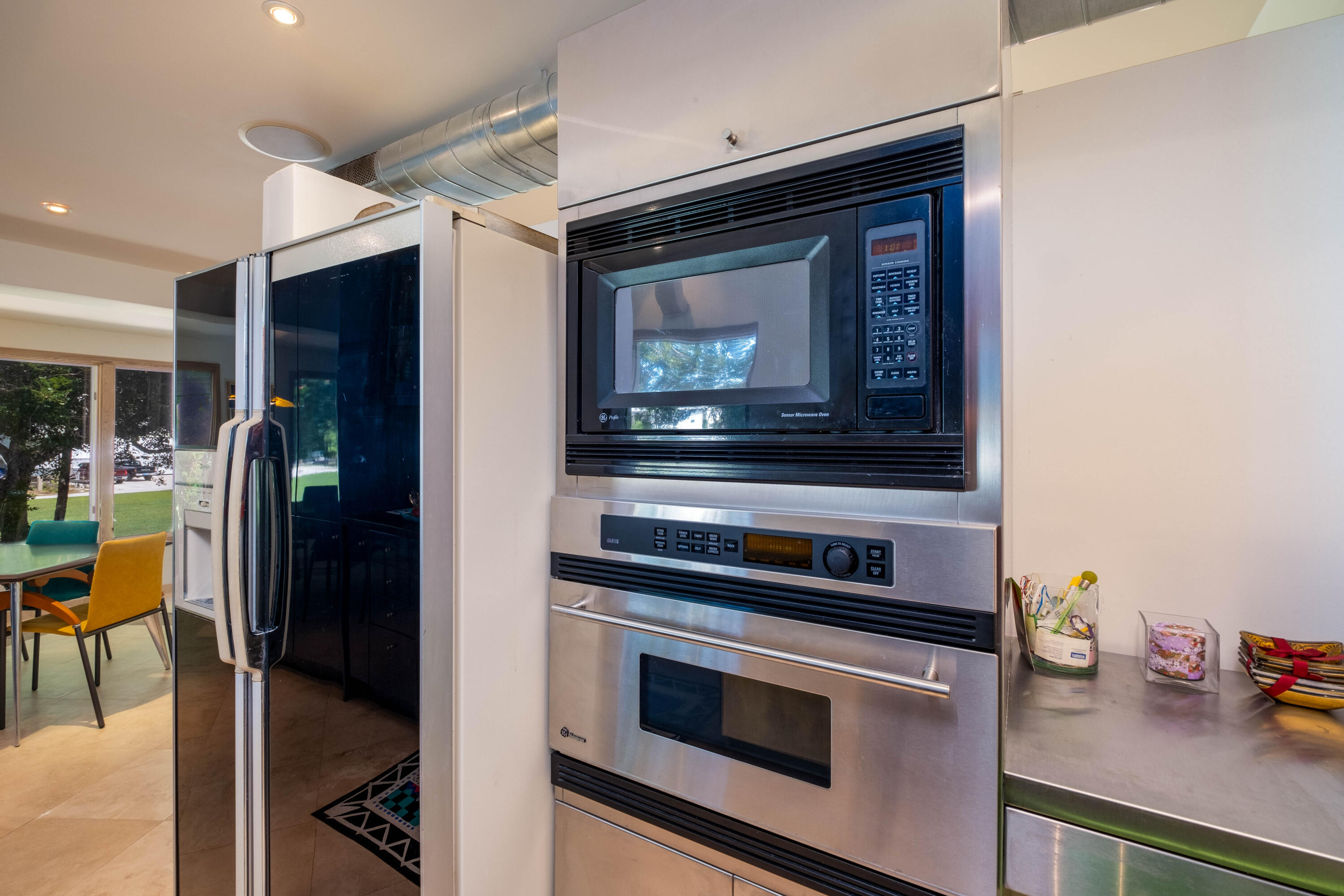 180 South Airport Road Tavernier, FL 33070 - Photo 13 of 33 a kitchen with granite countertop stainless steel appliances and wooden cabinets